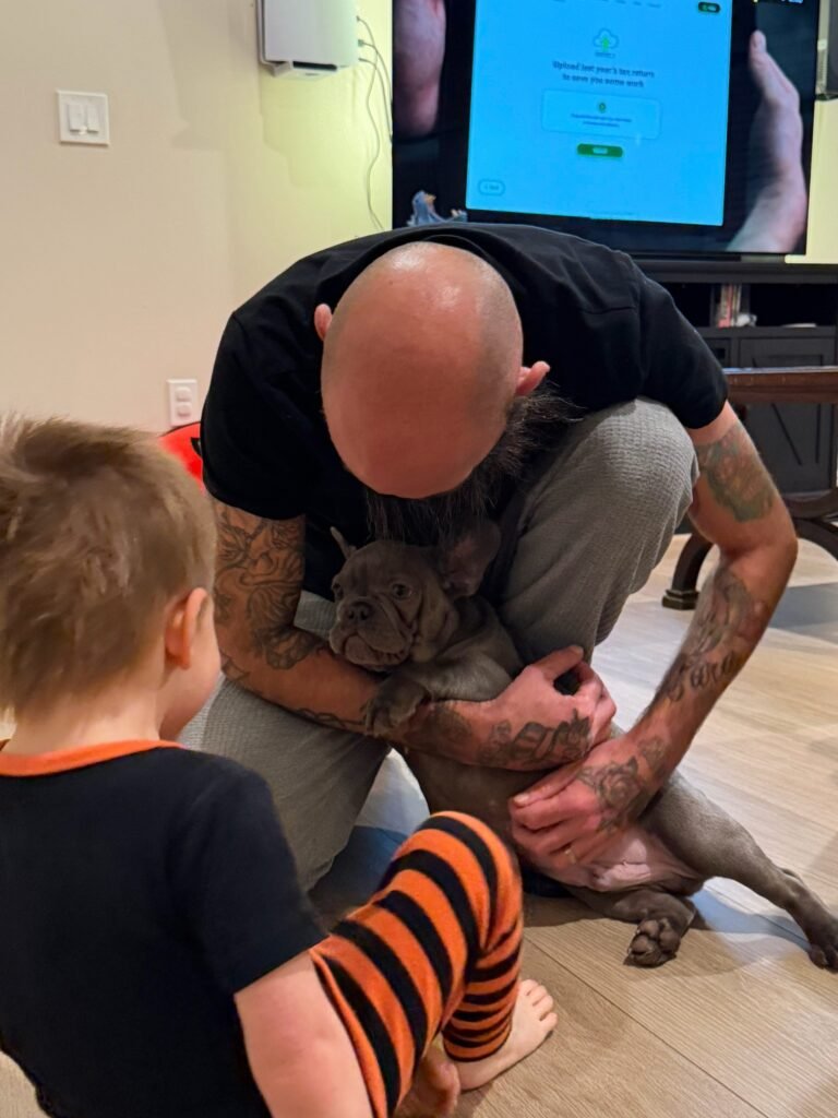 A Family Bullies puppy at home with its family
